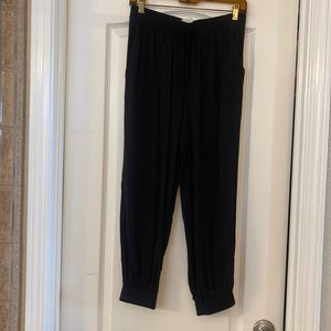 Black capri joggers with sinched bottoms and pockets. Brand new with tags